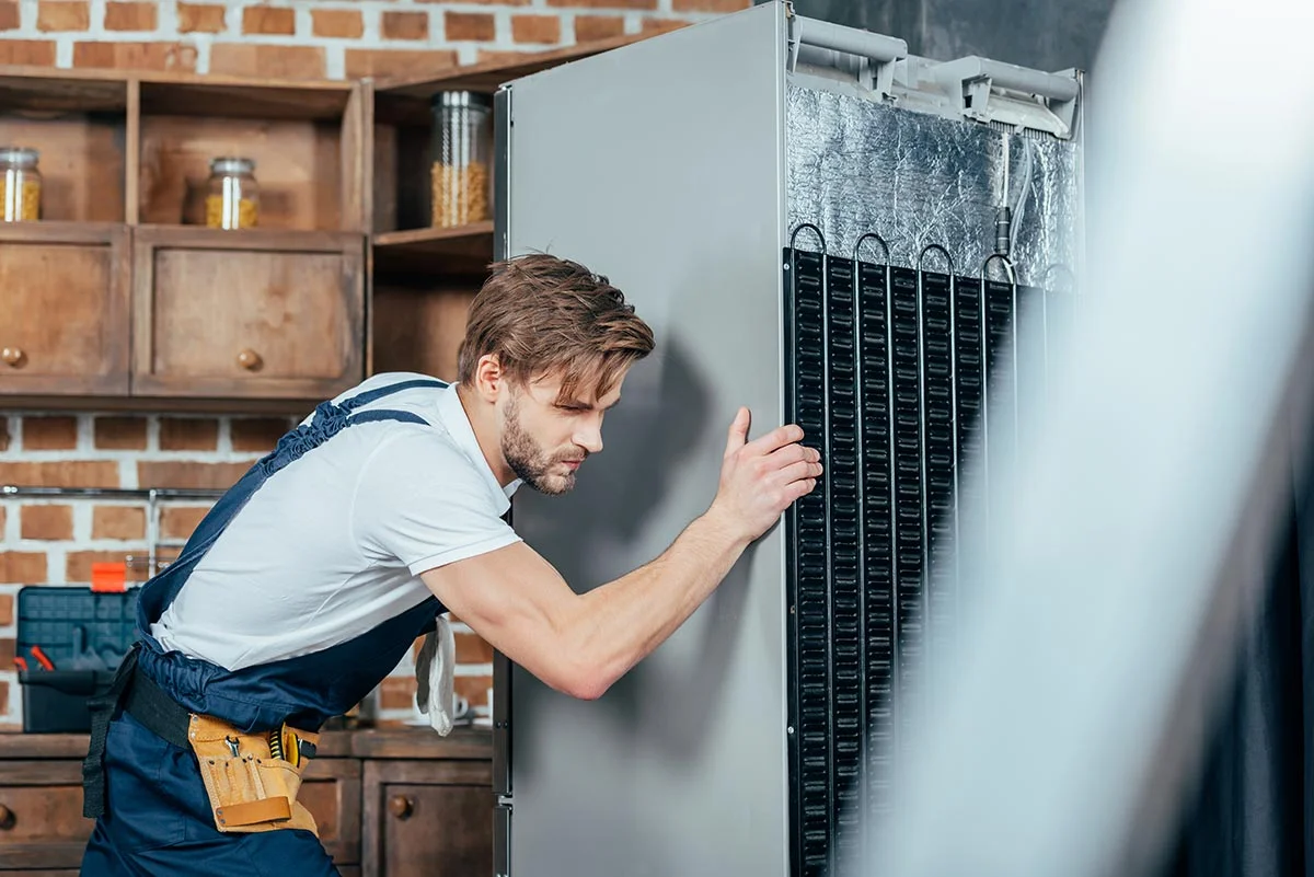 young-repairman-in-protective-workwear-moving-refr-resize.jpg young-repairman-in-protective-workwear-moving-refr-resize.jpg